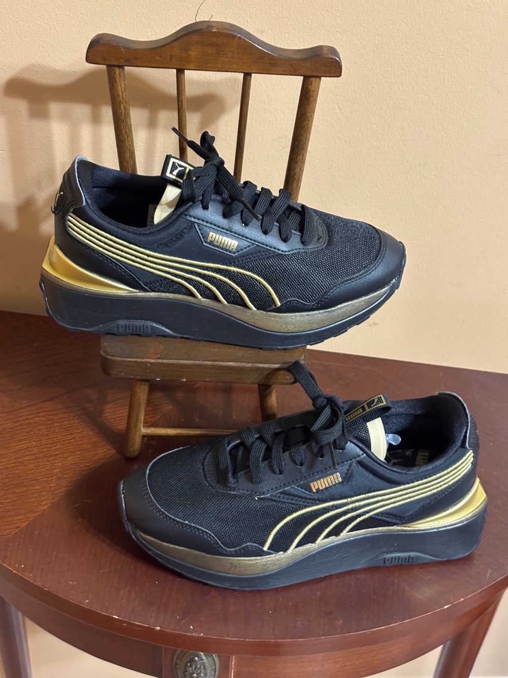 Puma Black & Gold Platform Sneakers